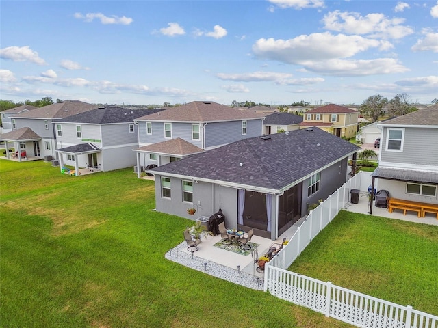 9577 Sandy Bluffs Cir, Parrish, FL 34219 - rear view of property featuring a shingled roof, a residential view, a patio, and a sunroom