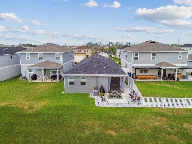 9577 Sandy Bluffs Cir, Parrish, FL 34219 - back of house featuring a patio area, a residential view, a shingled roof, and cooling unit