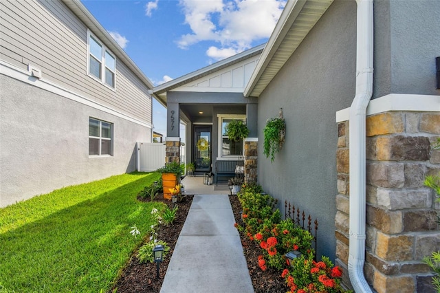 9577 Sandy Bluffs Cir, Parrish, FL 34219 - property entrance with stucco siding and board and batten siding