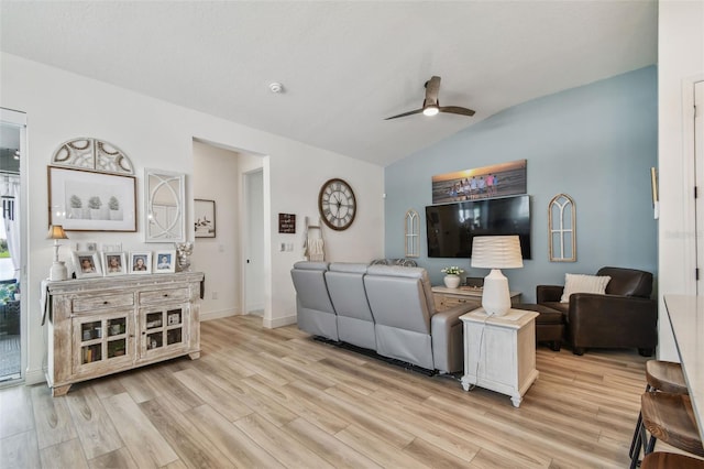 9577 Sandy Bluffs Cir, Parrish, FL 34219 - living room featuring a ceiling fan, vaulted ceiling, wood finished floors, and baseboards