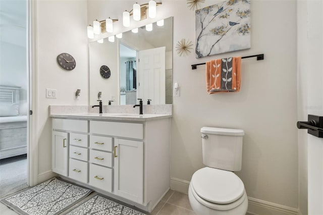 9577 Sandy Bluffs Cir, Parrish, FL 34219 - full bathroom with baseboards, double vanity, toilet, and tile patterned floors