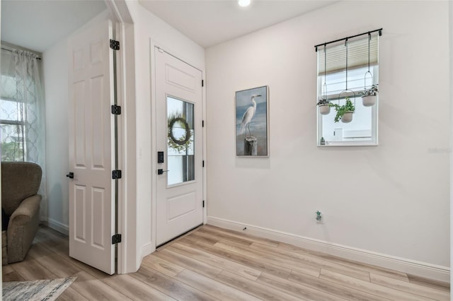 9577 Sandy Bluffs Cir, Parrish, FL 34219 - entryway featuring light wood-style flooring, baseboards, and recessed lighting