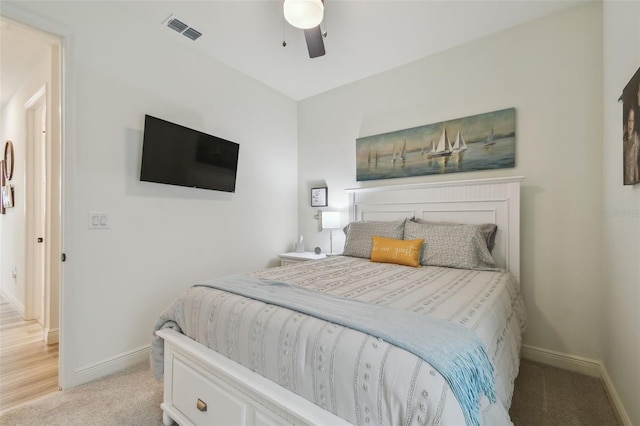 9577 Sandy Bluffs Cir, Parrish, FL 34219 - bedroom with baseboards, light colored carpet, and ceiling fan