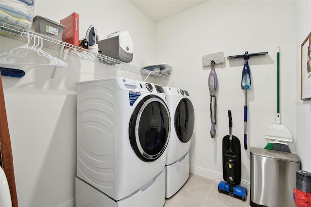 9577 Sandy Bluffs Cir, Parrish, FL 34219 - laundry area with separate washer and dryer, baseboards, and light tile patterned floors