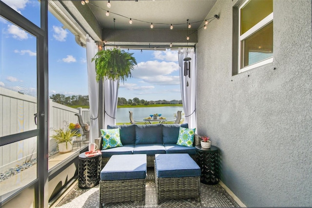 9577 Sandy Bluffs Cir, Parrish, FL 34219 - sunroom with a water view, a textured wall, and an outdoor living space