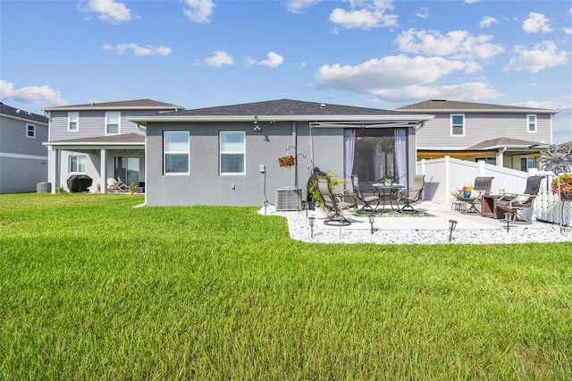 9577 Sandy Bluffs Cir, Parrish, FL 34219 - rear view of property with a patio area, a sunroom, stucco siding, and central AC