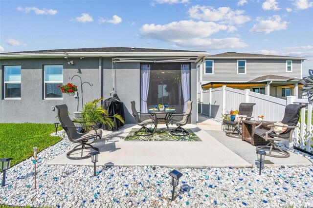 9577 Sandy Bluffs Cir, Parrish, FL 34219 - rear view of property with a patio area and stucco siding