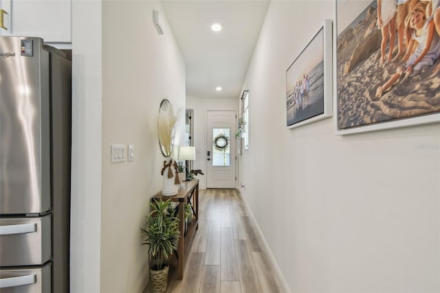 9577 Sandy Bluffs Cir, Parrish, FL 34219 - hall with light wood-style flooring, recessed lighting, and baseboards