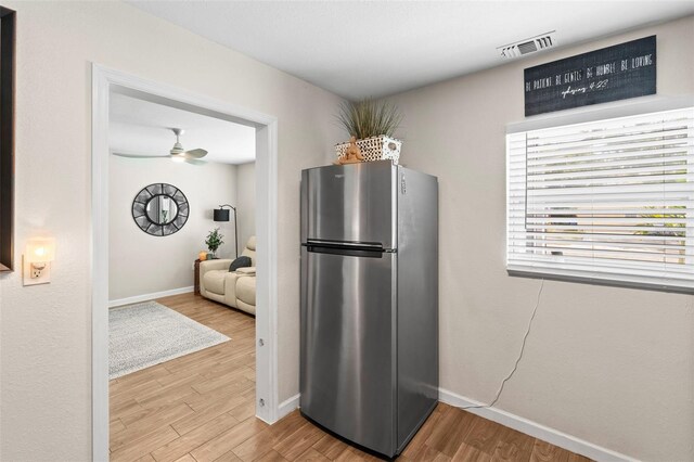 512 Flame Tree Dr, Apollo Beach, FL 33572 - kitchen featuring freestanding refrigerator, wood finished floors, baseboards, and a ceiling fan