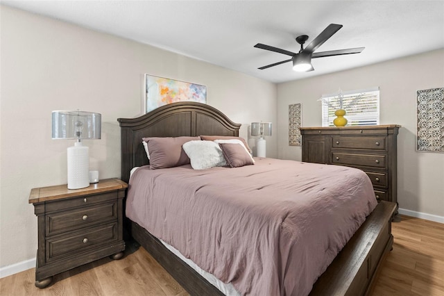 512 Flame Tree Dr, Apollo Beach, FL 33572 - bedroom with baseboards, light wood-style flooring, and ceiling fan