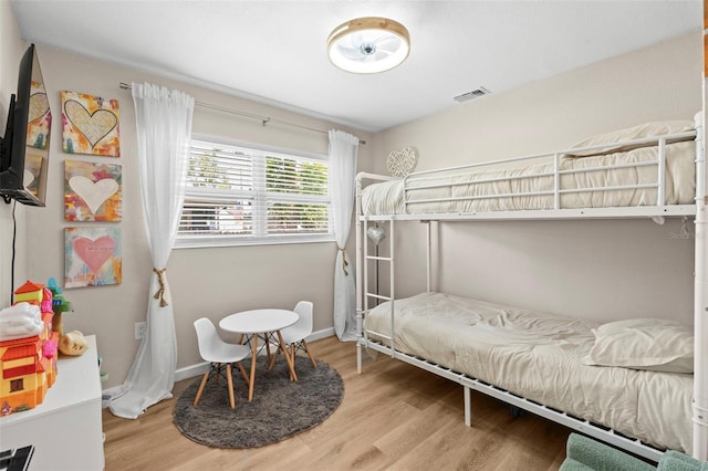 512 Flame Tree Dr, Apollo Beach, FL 33572 - bedroom featuring wood finished floors and baseboards