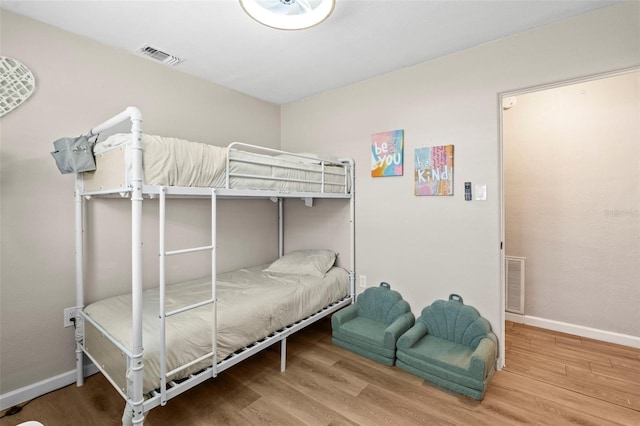 512 Flame Tree Dr, Apollo Beach, FL 33572 - bedroom featuring wood finished floors and baseboards