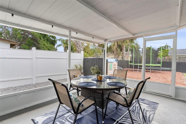 512 Flame Tree Dr, Apollo Beach, FL 33572 - sunroom with outdoor dining space