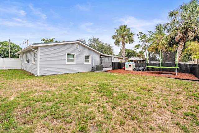 512 Flame Tree Dr, Apollo Beach, FL 33572 - view of yard featuring a trampoline and central AC unit