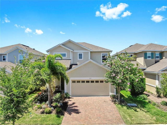6118 Voyagers Pl, Apollo Beach, FL 33572 - view of front of home featuring decorative driveway and a residential view