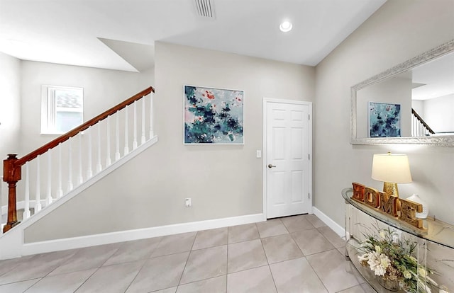 6118 Voyagers Pl, Apollo Beach, FL 33572 - tiled foyer with stairway and baseboards