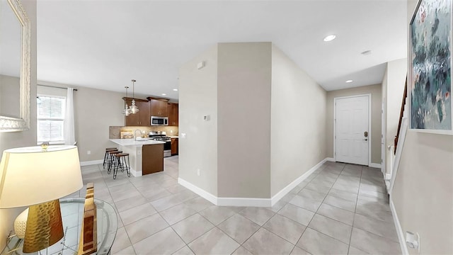 6118 Voyagers Pl, Apollo Beach, FL 33572 - hall with light tile patterned flooring and recessed lighting