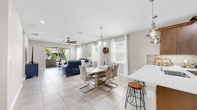 6118 Voyagers Pl, Apollo Beach, FL 33572 - dining area with recessed lighting, light tile patterned flooring, and a ceiling fan