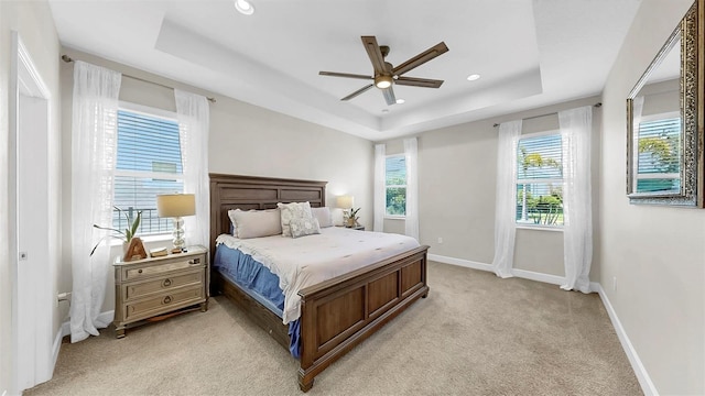 6118 Voyagers Pl, Apollo Beach, FL 33572 - bedroom featuring a raised ceiling, light carpet, recessed lighting, and a ceiling fan