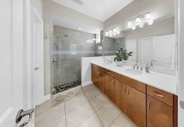 6118 Voyagers Pl, Apollo Beach, FL 33572 - bathroom featuring a stall shower, double vanity, and tile patterned floors