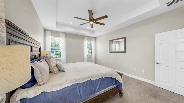 6118 Voyagers Pl, Apollo Beach, FL 33572 - bedroom with a tray ceiling, carpet flooring, recessed lighting, and a ceiling fan