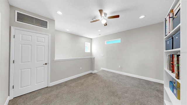 6118 Voyagers Pl, Apollo Beach, FL 33572 - spare room with carpet floors, ceiling fan, and recessed lighting