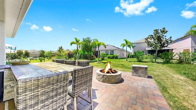 6118 Voyagers Pl, Apollo Beach, FL 33572 - view of patio / terrace with an outdoor fire pit and a residential view