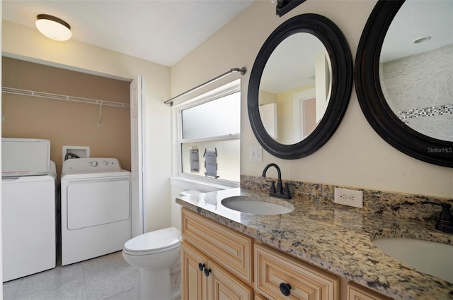 6419 S Englewood Ave, Tampa, FL 33611 - full bathroom featuring independent washer and dryer, double vanity, toilet, and tile patterned flooring