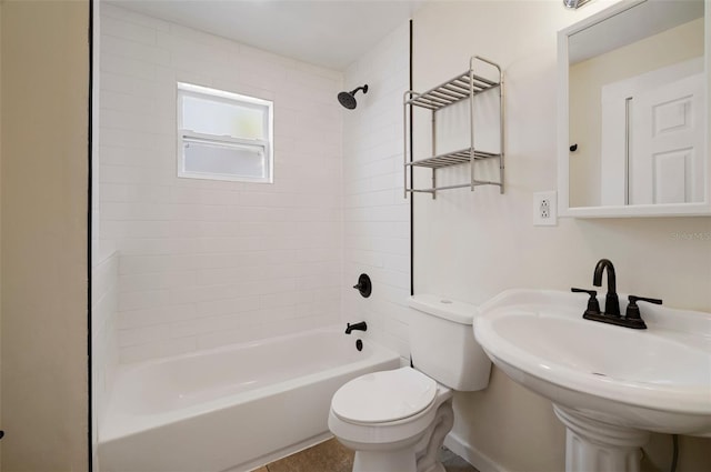 6419 S Englewood Ave, Tampa, FL 33611 - full bathroom with toilet, shower / washtub combination, a sink, and baseboards