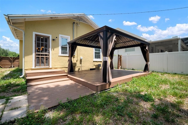 6419 S Englewood Ave, Tampa, FL 33611 - rear view of house with a gazebo, stucco siding, and a deck