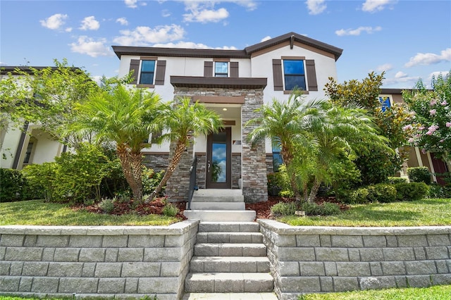 13311 Dorado Shores Ave, Riverview, FL 33579 - contemporary house featuring stucco siding and stone siding