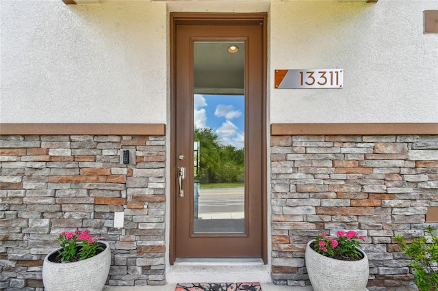 13311 Dorado Shores Ave, Riverview, FL 33579 - entrance to property featuring stucco siding and stone siding