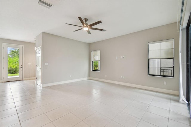 13311 Dorado Shores Ave, Riverview, FL 33579 - spare room featuring ceiling fan, plenty of natural light, baseboards, and light tile patterned flooring