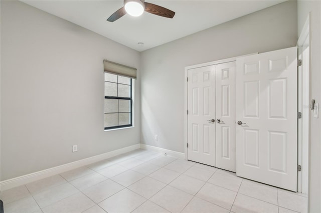 13311 Dorado Shores Ave, Riverview, FL 33579 - unfurnished bedroom featuring a closet, light tile patterned floors, baseboards, and a ceiling fan