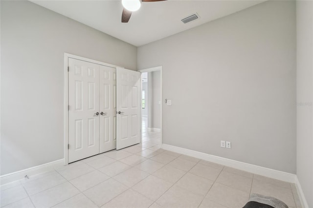13311 Dorado Shores Ave, Riverview, FL 33579 - unfurnished bedroom featuring light tile patterned flooring and baseboards