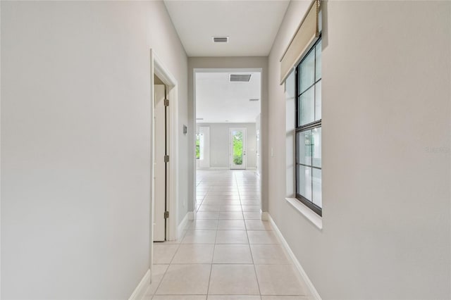 13311 Dorado Shores Ave, Riverview, FL 33579 - hall featuring light tile patterned flooring and baseboards