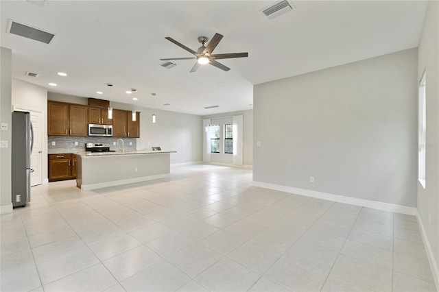 13311 Dorado Shores Ave, Riverview, FL 33579 - unfurnished living room featuring ceiling fan, recessed lighting, light tile patterned floors, baseboards, and a sink