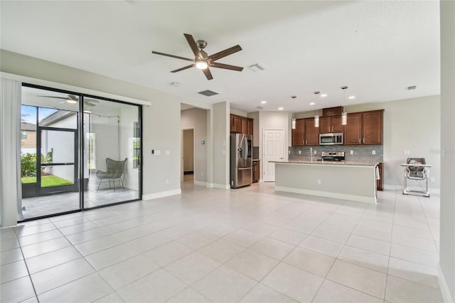 13311 Dorado Shores Ave, Riverview, FL 33579 - unfurnished living room with ceiling fan, light tile patterned floors, baseboards, and recessed lighting