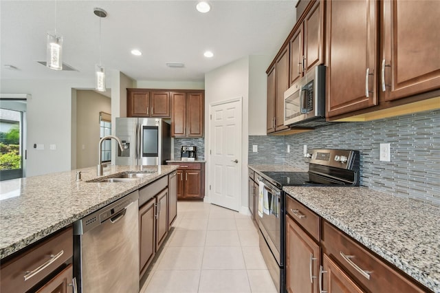 13311 Dorado Shores Ave, Riverview, FL 33579 - kitchen with appliances with stainless steel finishes, a sink, tasteful backsplash, light tile patterned floors, and recessed lighting