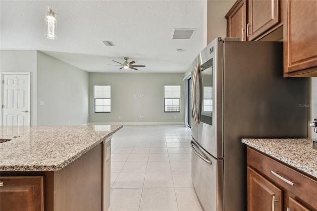 13311 Dorado Shores Ave, Riverview, FL 33579 - kitchen featuring smart refrigerator, ceiling fan, baseboards, light stone counters, and light tile patterned floors
