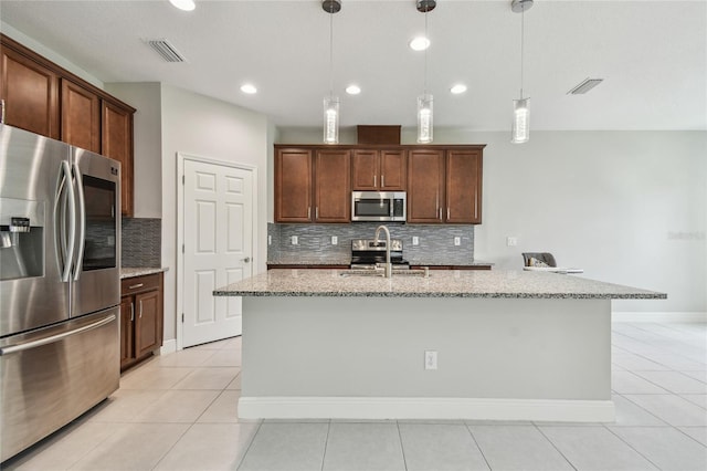 13311 Dorado Shores Ave, Riverview, FL 33579 - kitchen with appliances with stainless steel finishes, a sink, tasteful backsplash, light stone countertops, and recessed lighting