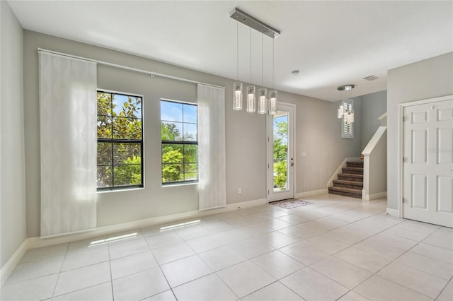 13311 Dorado Shores Ave, Riverview, FL 33579 - spare room with stairway, baseboards, and light tile patterned flooring