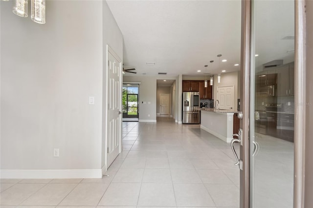13311 Dorado Shores Ave, Riverview, FL 33579 - foyer entrance with light tile patterned floors, recessed lighting, baseboards, and a chandelier