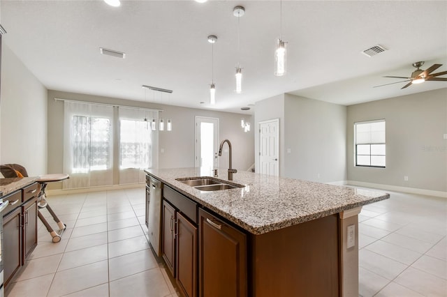 13311 Dorado Shores Ave, Riverview, FL 33579 - kitchen with open floor plan, a sink, light tile patterned flooring, and a center island with sink