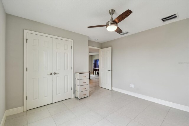 13311 Dorado Shores Ave, Riverview, FL 33579 - unfurnished bedroom featuring a closet, baseboards, and ceiling fan
