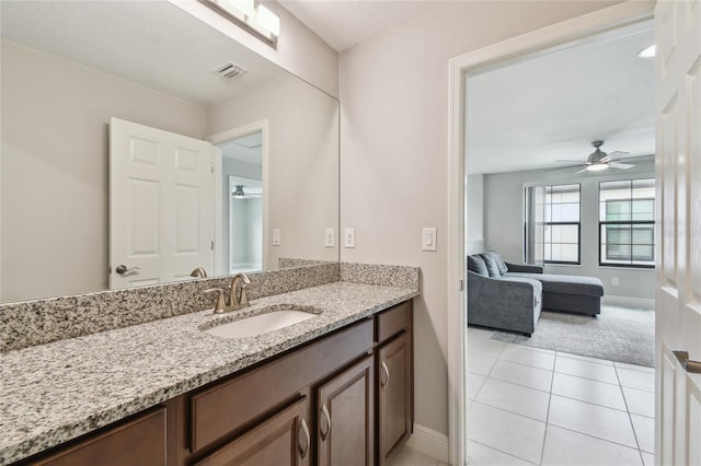 13311 Dorado Shores Ave, Riverview, FL 33579 - bathroom with a ceiling fan, baseboards, vanity, and tile patterned floors