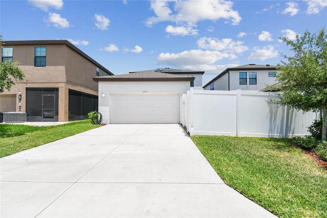 13311 Dorado Shores Ave, Riverview, FL 33579 - view of front of house with stucco siding, driveway, an attached garage, and central AC