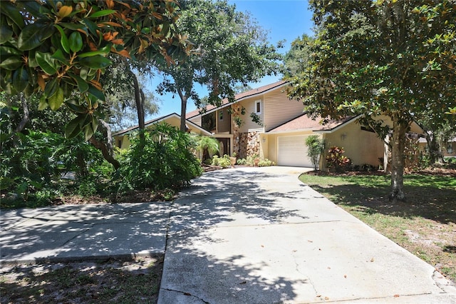 12929 Sugar Creek Blvd, Hudson, FL 34669 - view of front of property with driveway and an attached garage