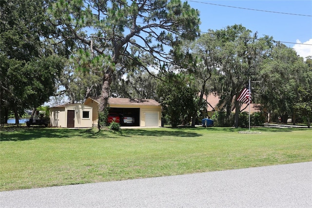 12929 Sugar Creek Blvd, Hudson, FL 34669 - view of front of home featuring an outbuilding and a front yard