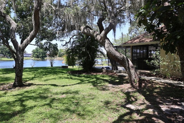 12929 Sugar Creek Blvd, Hudson, FL 34669 - view of grassy yard featuring a water view and a sunroom